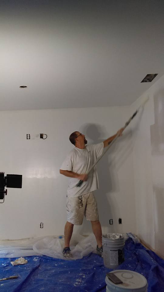 millers employee rolling primer